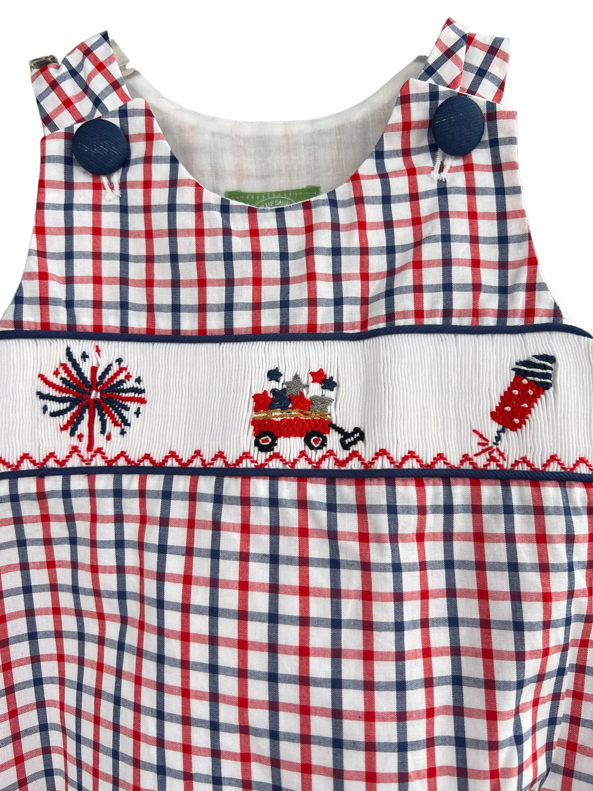 Up close hand smocked rocket, wagon with stars and fireworks