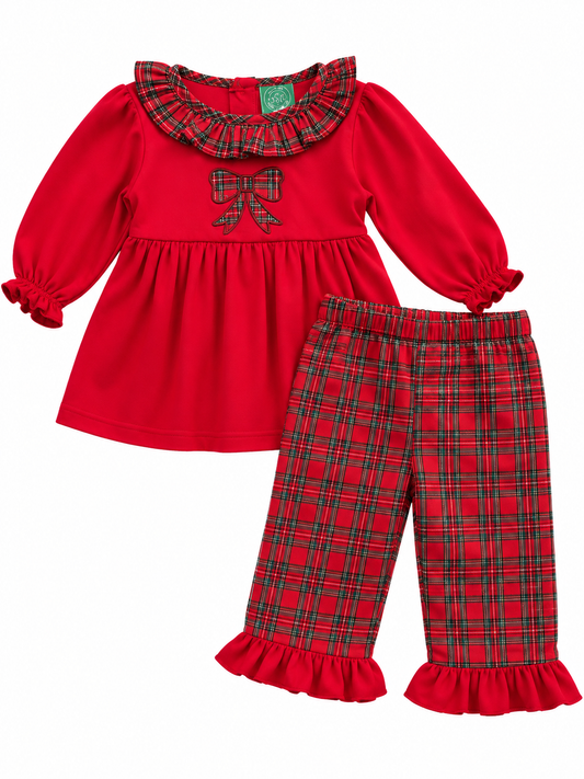 A toddler girl's holiday-themed two-piece outfit featuring a bright red long-sleeve top with a green and red plaid ruffled collar, a matching plaid bow on the chest, and matching red and green plaid pants with ruffled hems.