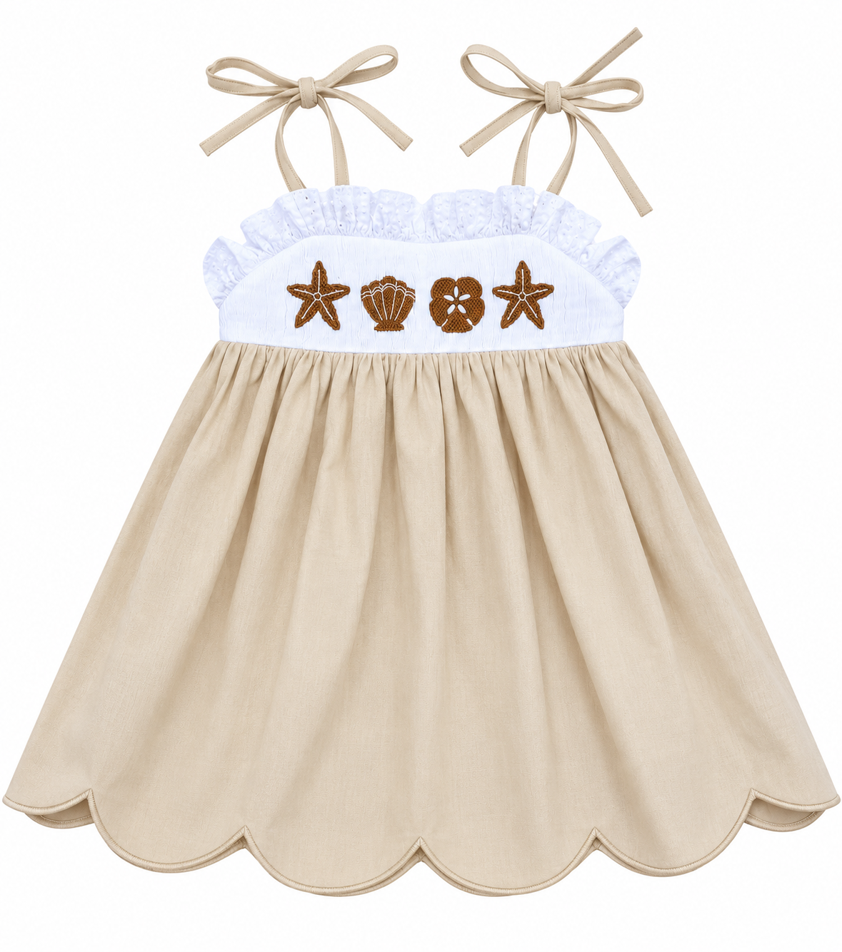 Girls’ beige hand-smocked seashell sundress with embroidered starfish and shells, white ruffle bodice, tie straps, and scalloped hem.
