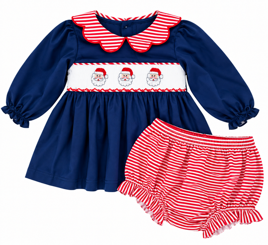 Girls hand smocked Santa Christmas bloomer set featuring a royal blue long sleeve top with three Santa faces, red and white striped scalloped collar, and matching ruffled striped bloomers.