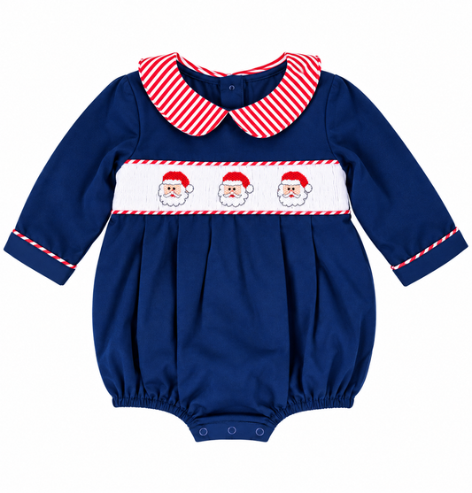 Boys royal blue hand smocked Santa Christmas bubble with three Santa faces, red and white striped Peter Pan collar, long sleeves and snap closures.