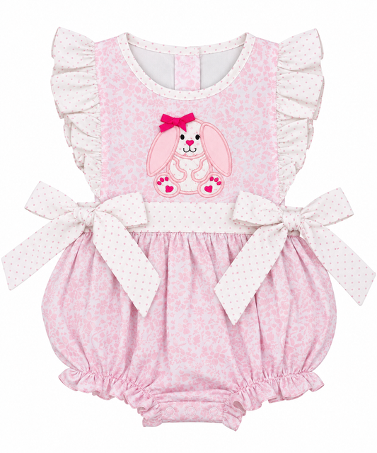 Girls pink Easter bunny appliqué bubble romper with floral print, polka dot ruffles and side bows.