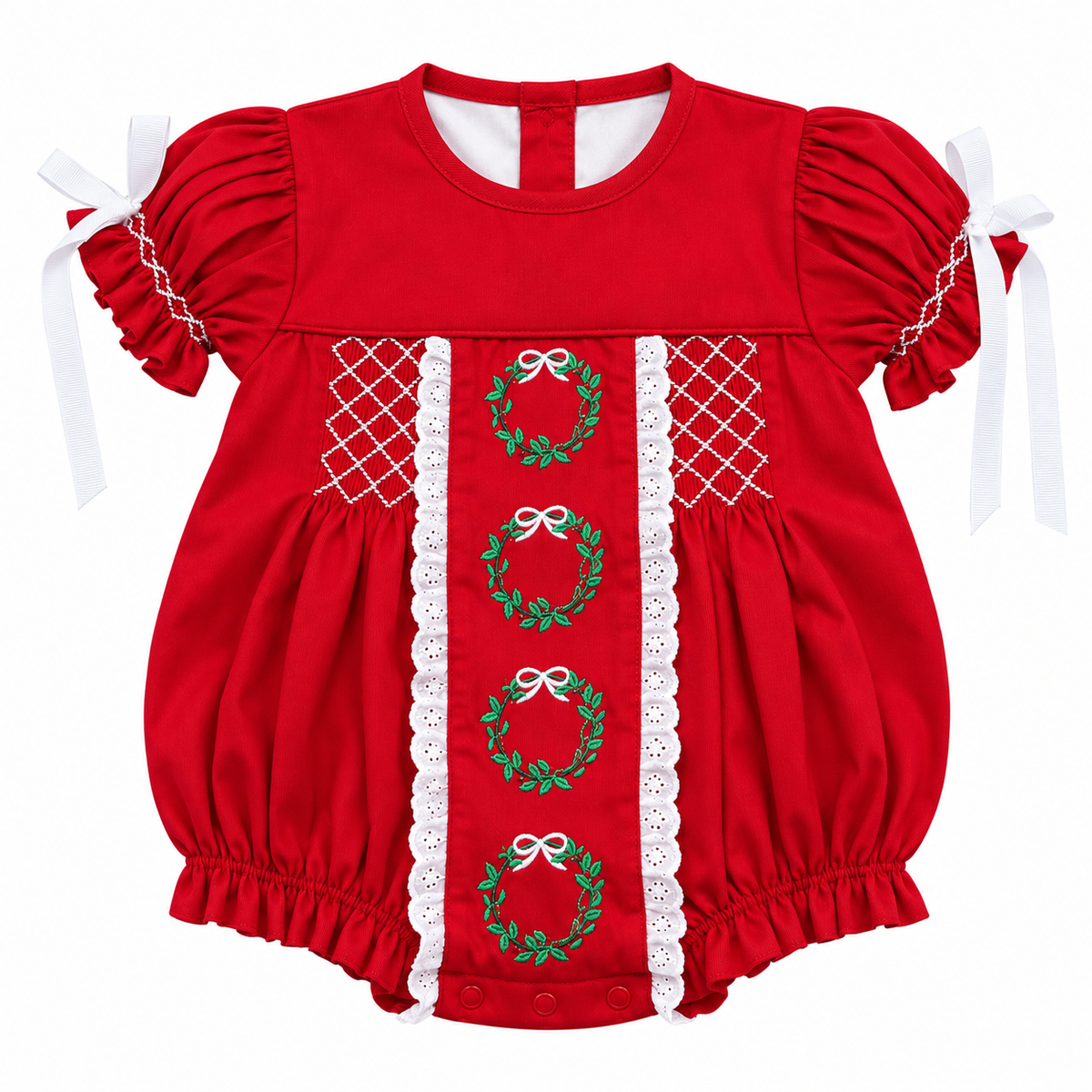 A red baby romper with short puff sleeves, white lace trim, and green embroidered wreaths with white bows down the center front.